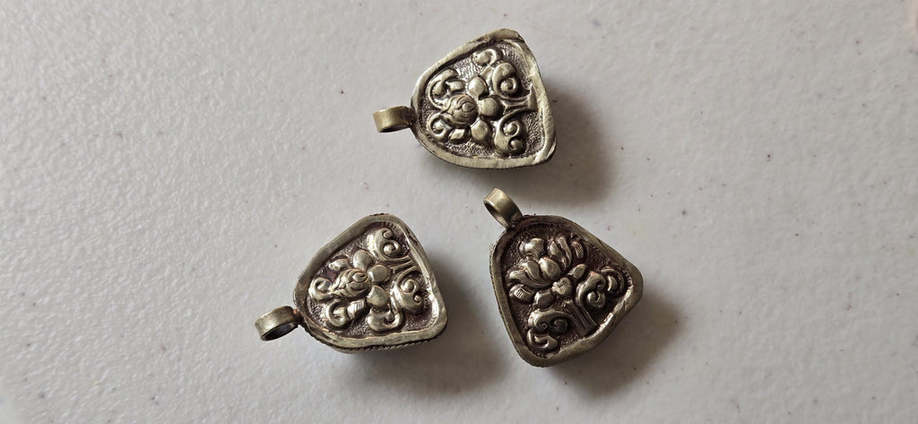 Tibetan antiqued silver color encased turquoise howlite happy Buddha face focal pendant floral carving - PM001A