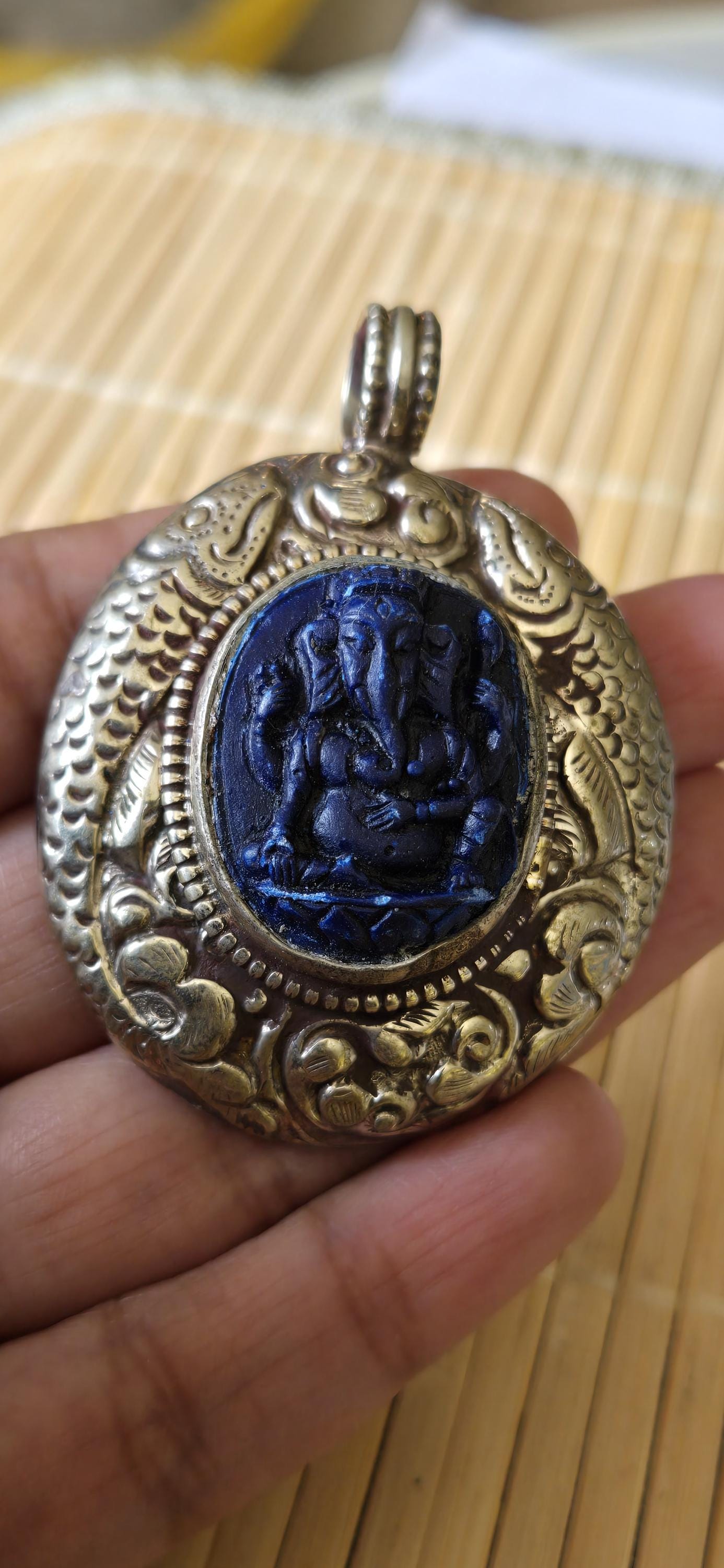 Tibetan silver blue Ganesha pendant with Fish symbol on side and floral repousse on reverse - PM272K