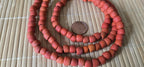Ethnic nepali reddish orange salmon sherpa glass beads strand from Nepal -BD944G