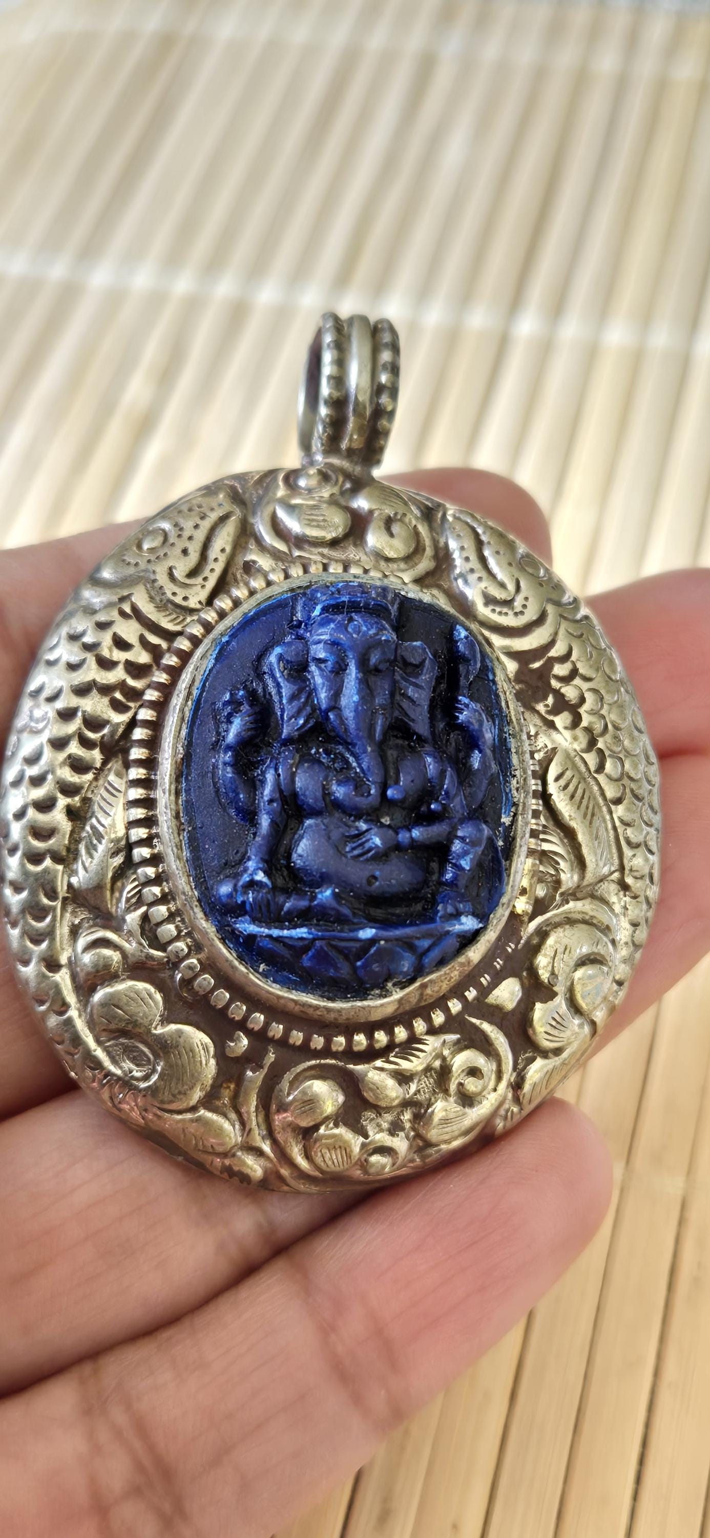Tibetan silver blue Ganesha pendant with Fish symbol on side and floral repousse on reverse - PM272K