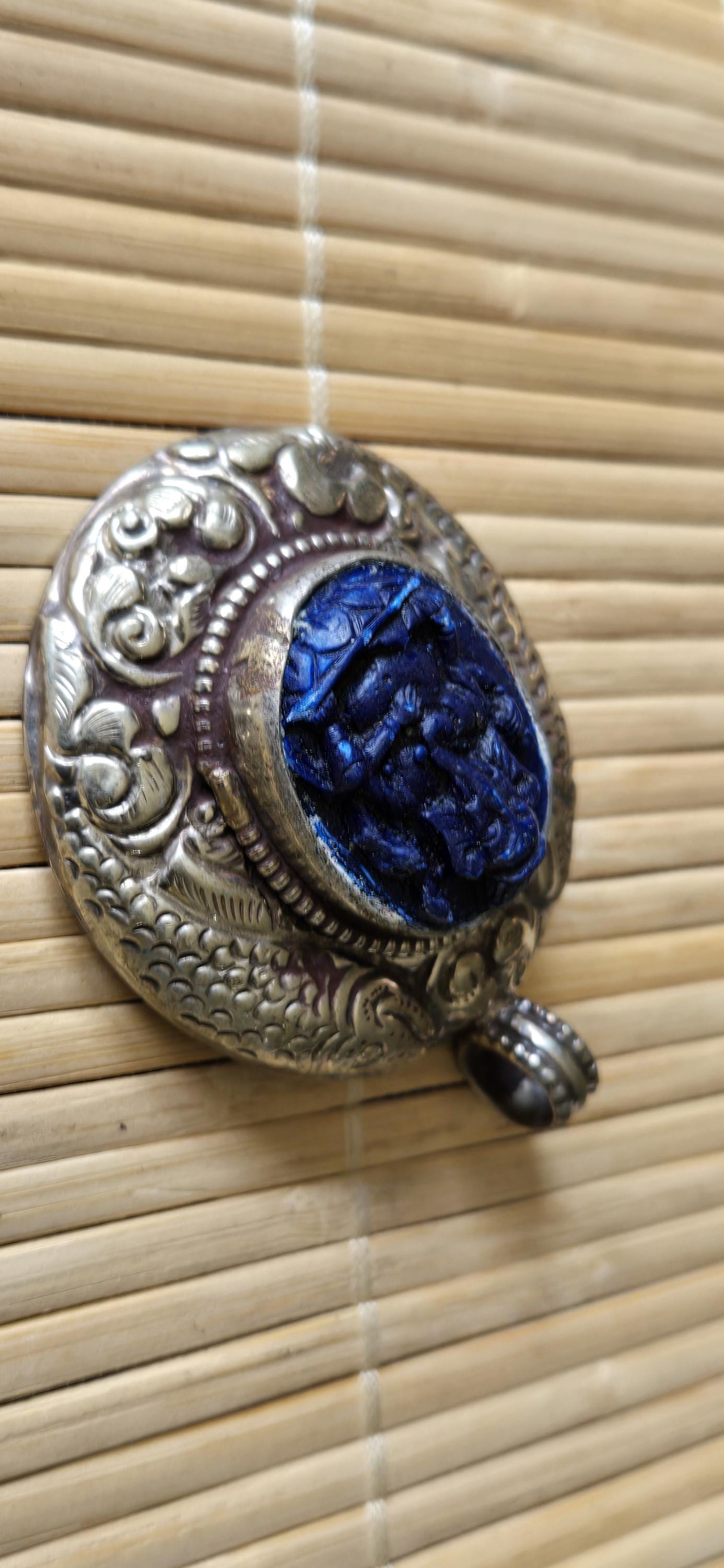Tibetan silver blue Ganesha pendant with Fish symbol on side and floral repousse on reverse - PM272K