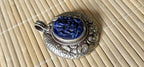 Tibetan silver blue Ganesha pendant with Fish symbol on side and floral repousse on reverse - PM272K