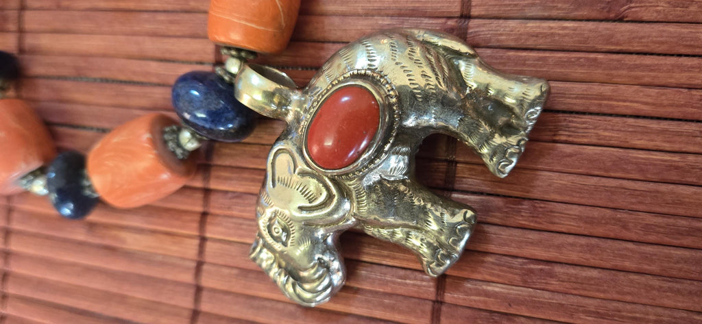 Tibetan Elephant Pendant with red coral inlay | Repousse Jewelry from Nepal | Bold Animal pendant PM438L