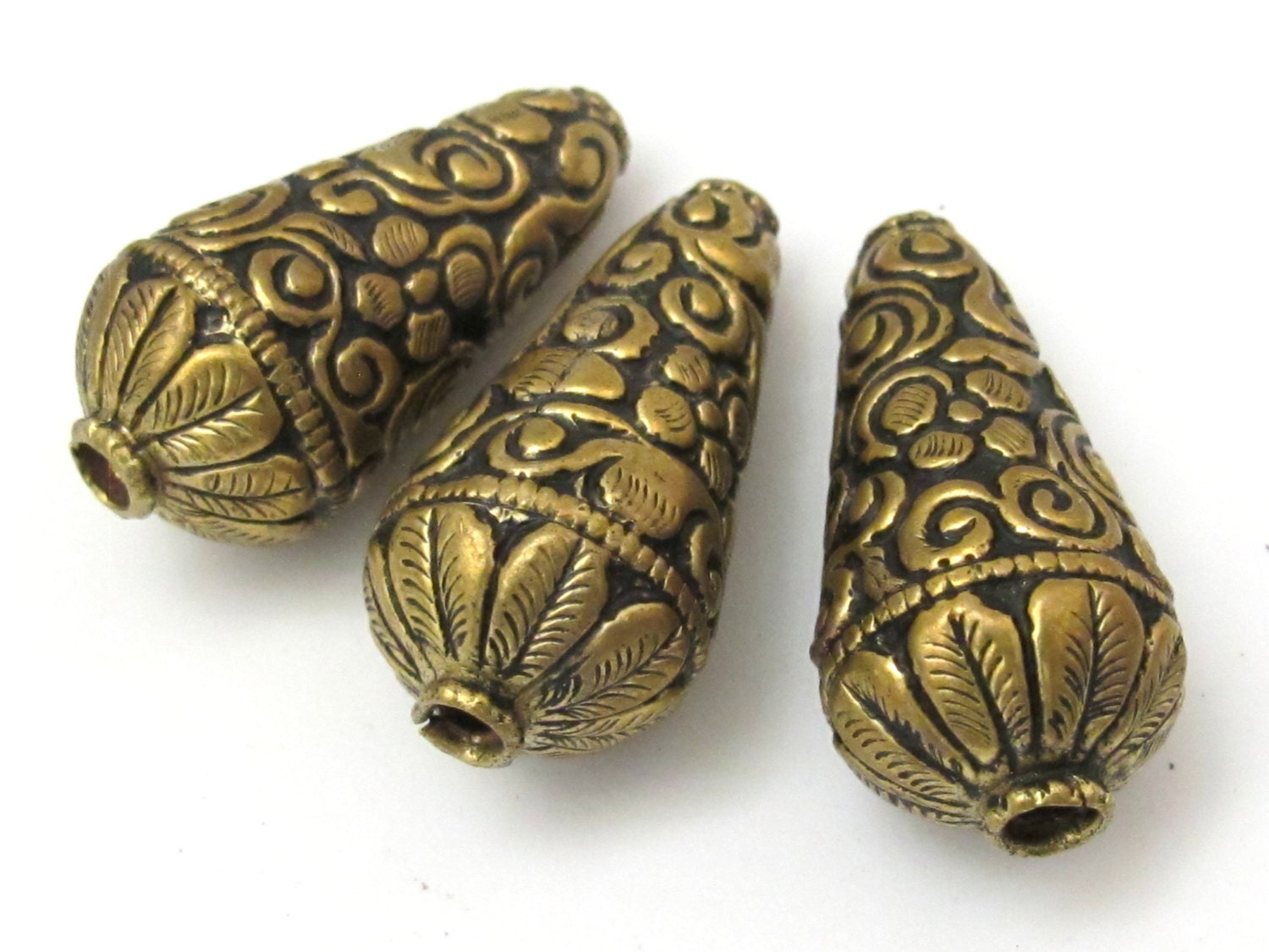 2 BEADS - Cone shape brass beads with floral repousse antiqued gold tone from Nepal - BD620