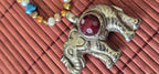 Tibetan Elephant Pendant with wine color faceted quartz gemstone inlay | Repousse Jewelry from Nepal | Bold Animal pendant PM438Q