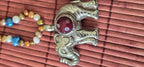 Tibetan Elephant Pendant with wine color faceted quartz gemstone inlay | Repousse Jewelry from Nepal | Bold Animal pendant PM438Q