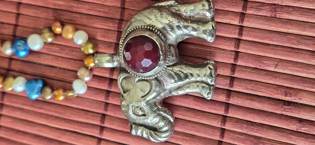 Tibetan Elephant Pendant with wine color faceted quartz gemstone inlay | Repousse Jewelry from Nepal | Bold Animal pendant PM438Q