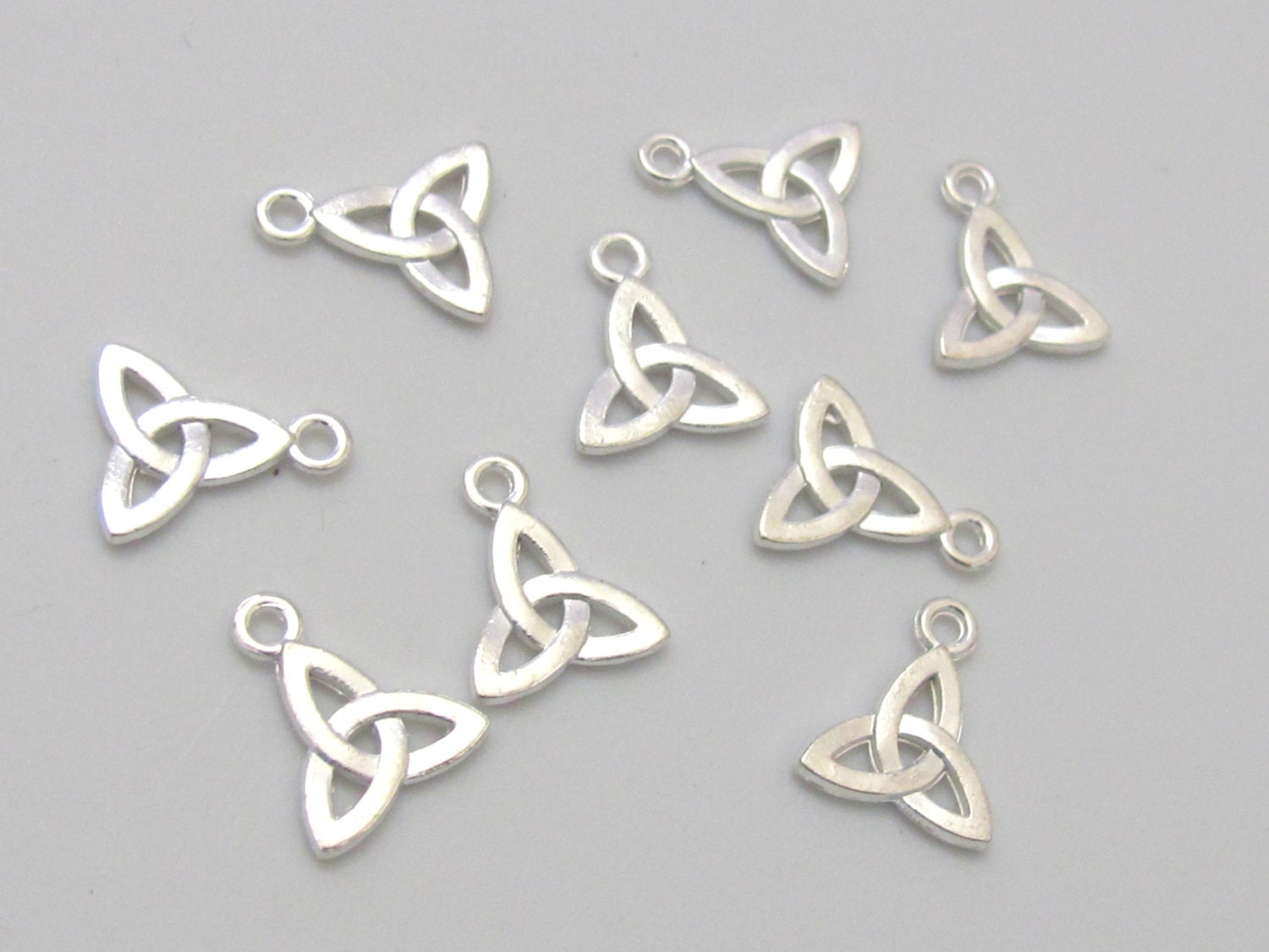 10 charms - Celtic trinity knot symbol silver tone small size charms 12mm x 10mm - CM088