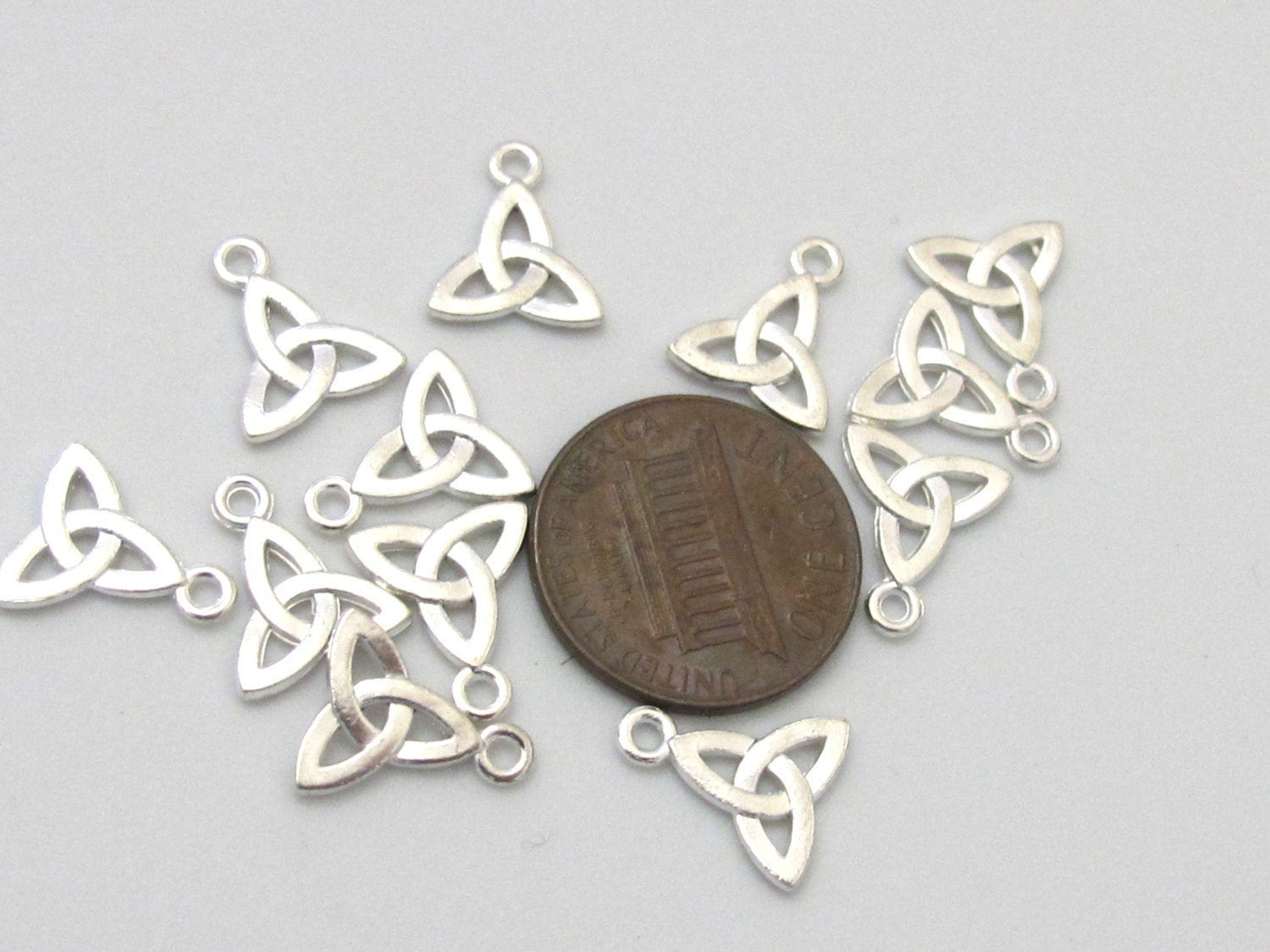 10 charms - Celtic trinity knot symbol silver tone small size charms 12mm x 10mm - CM088