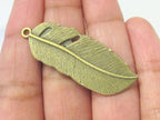 4 Large Brass tone feather charms 43 mm x 15 mm - CM092