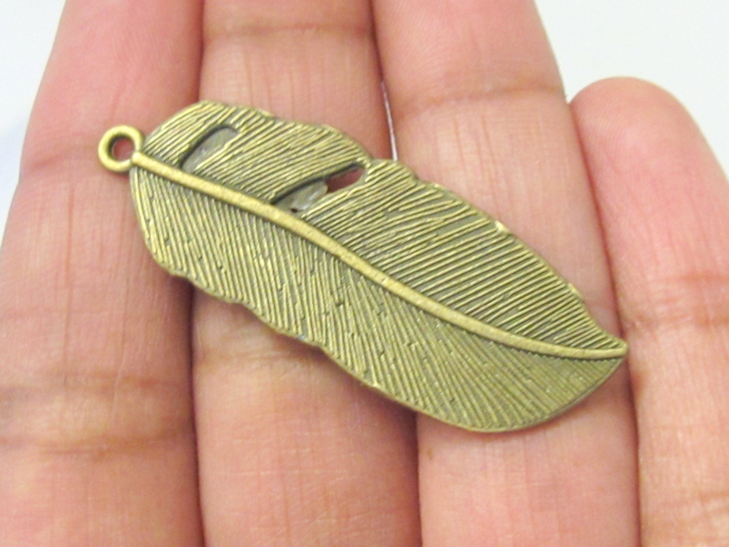 4 Large Brass tone feather charms 43 mm x 15 mm - CM092