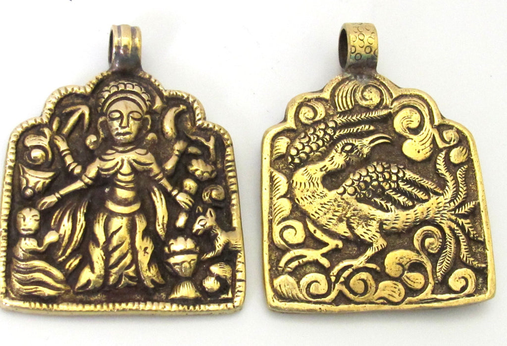 1 Pendant - Reversible ethnic forest deity brass pendant with reverse bird design from Nepal - CP074