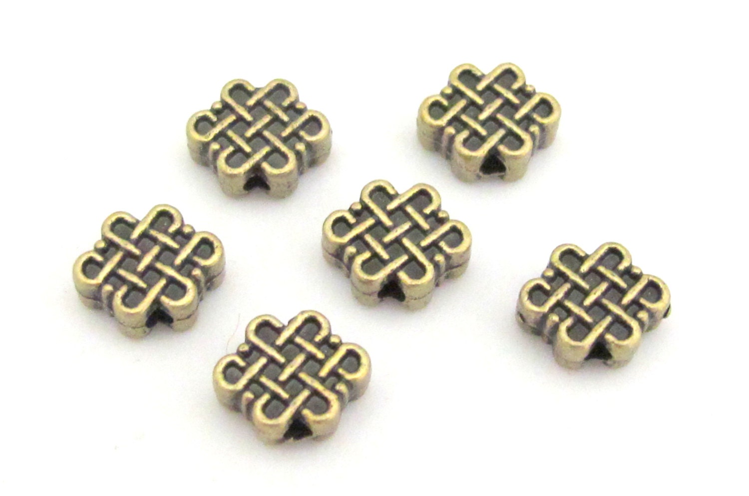 6 Beads - Reversible Tibetan infinity knot symbol brass tone small size beads 11 mm x 9 mm - BD668