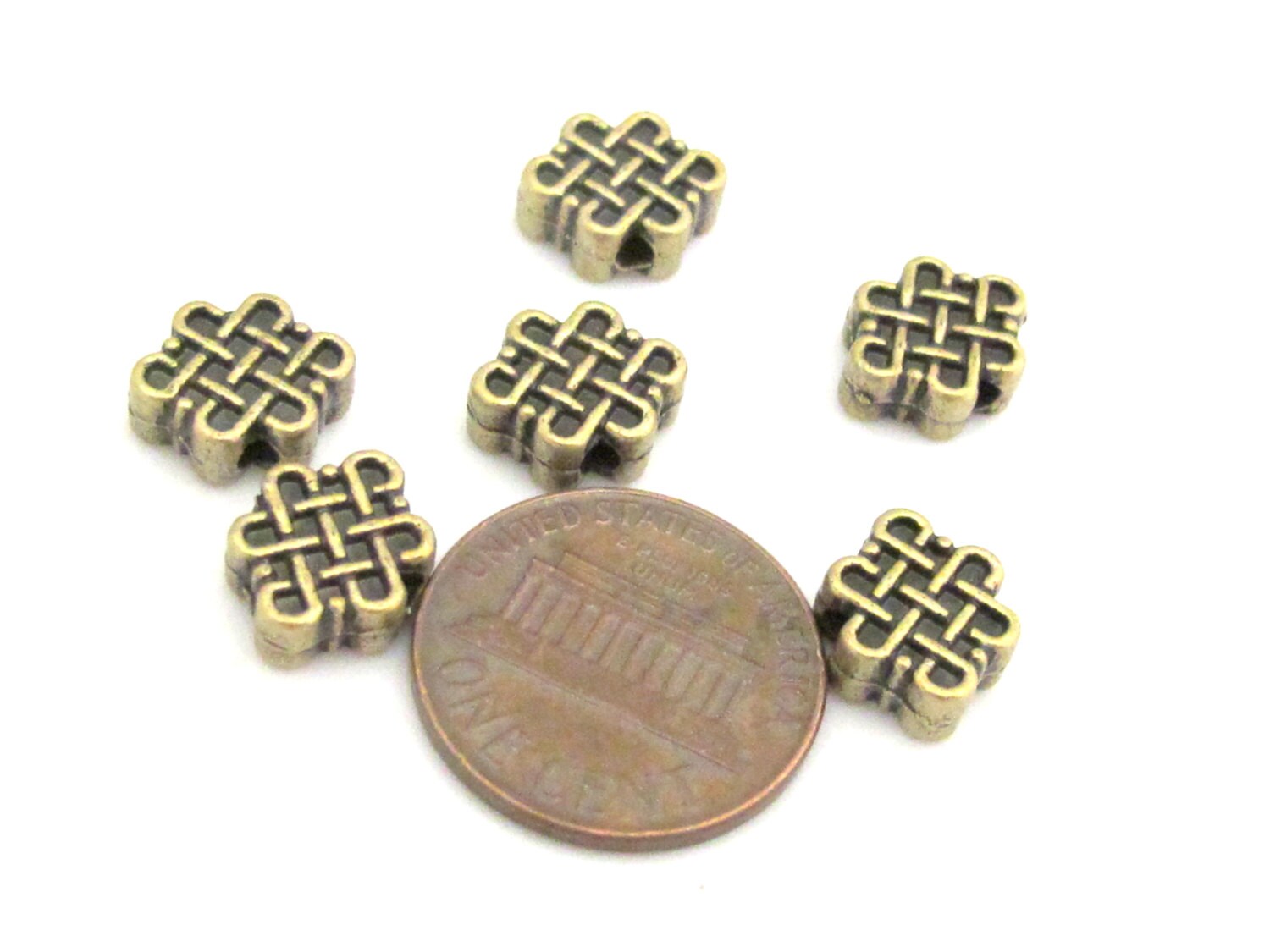 6 Beads - Reversible Tibetan infinity knot symbol brass tone small size beads 11 mm x 9 mm - BD668