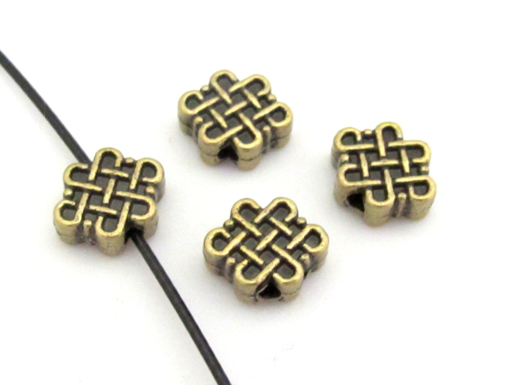 6 Beads - Reversible Tibetan infinity knot symbol brass tone small size beads 11 mm x 9 mm - BD668