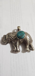 Tibetan Elephant Pendant with turquoise gemstone inlay | Handmade Repousse Jewelry from Nepal | Bold Animal pendant PM438A1