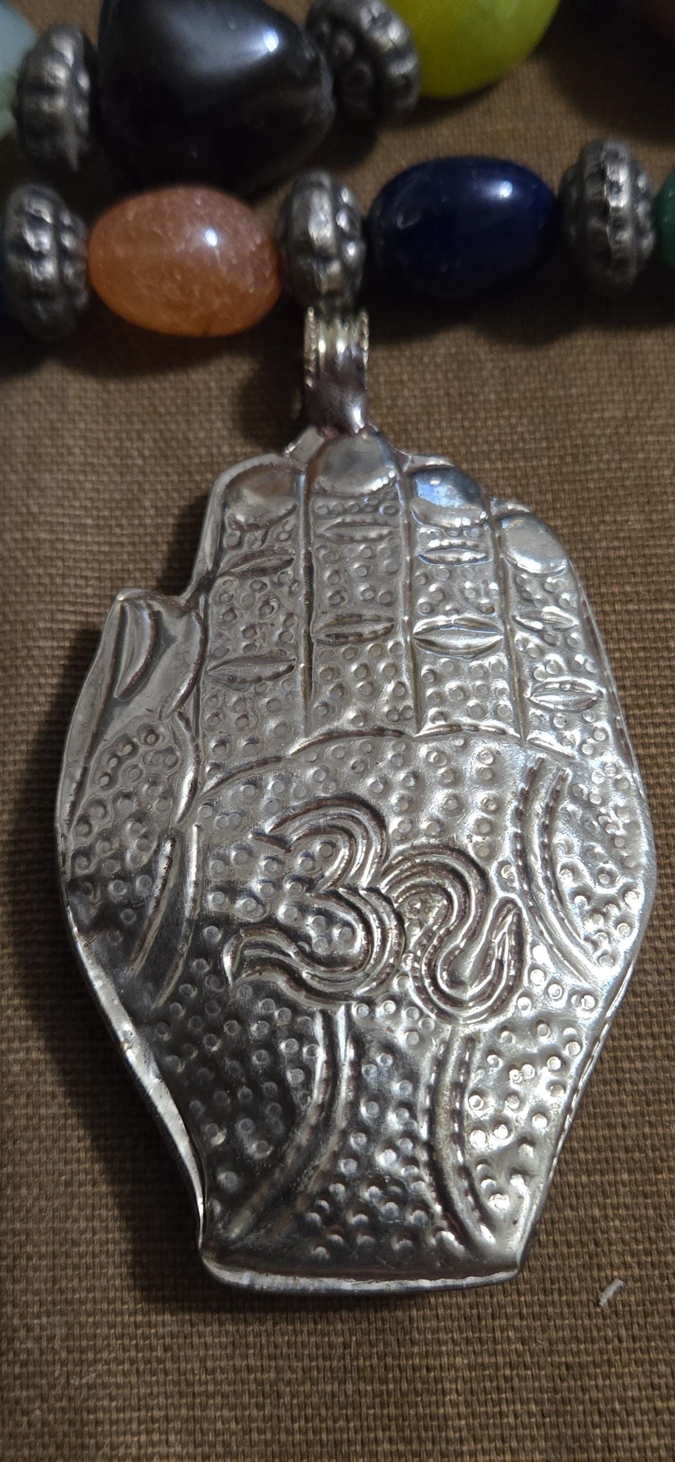 AS is - crude finish large bold size Buddha hand turquoise coral inlaid Om inscribed reversible pendant rustic antiqued finish- PM240C