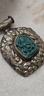 Tibetan antiqued silver finish green Vajrapani Buddha pendant with double fish symbol and reverse floral repousse - PM346C