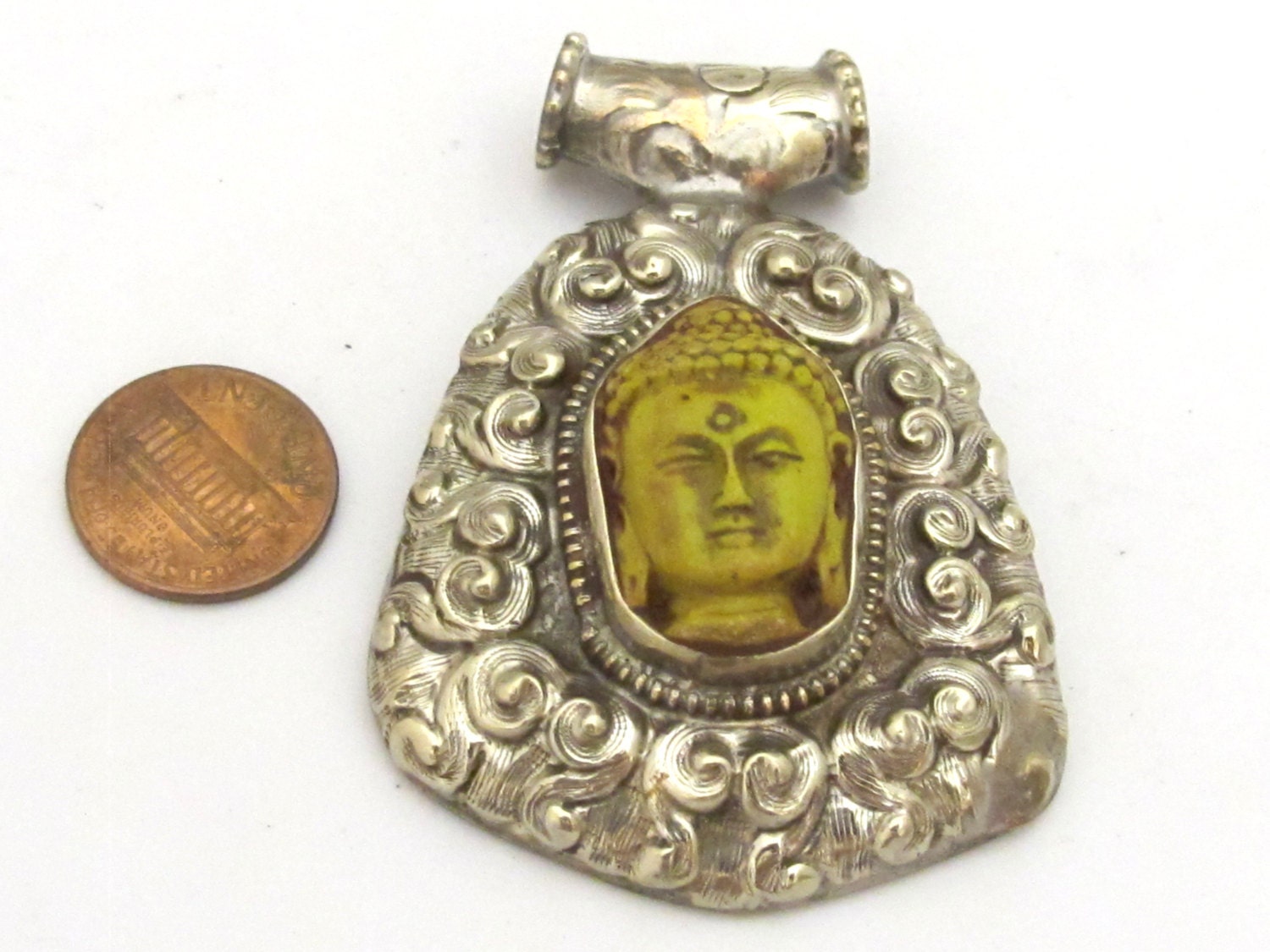 Tibetan silver yellow Buddha pendant with floral repousse details - PM337B