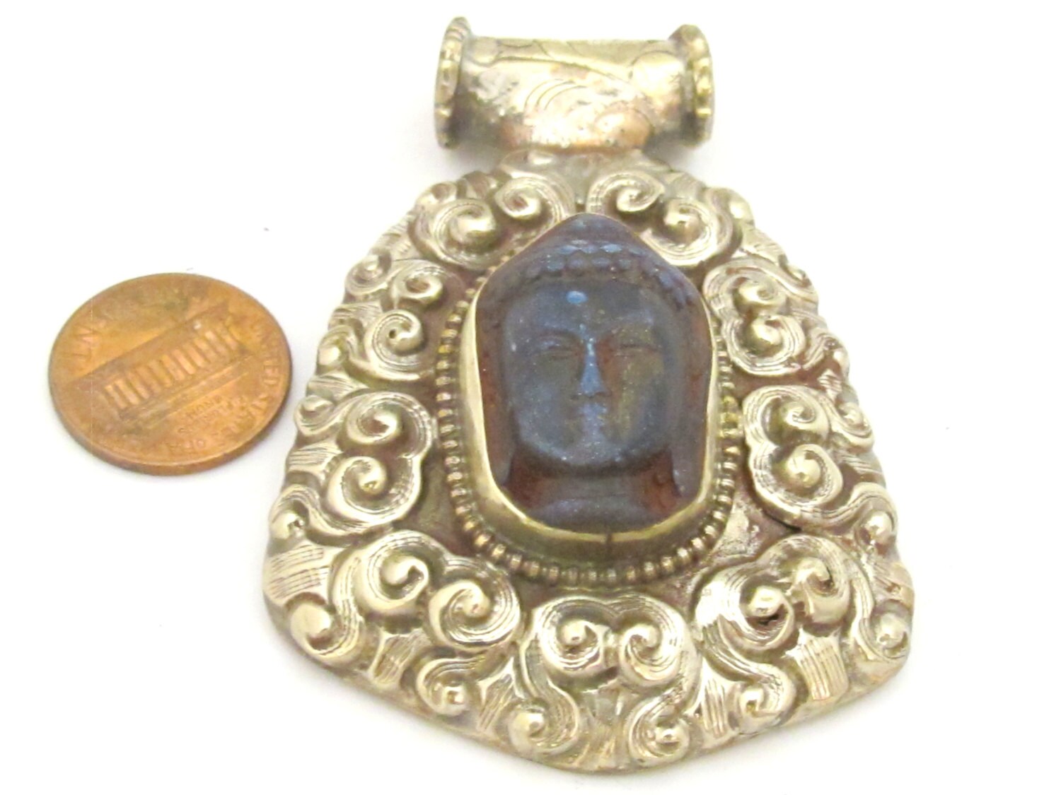 Tibetan silver blue Buddha pendant with floral repousse details - PM336B