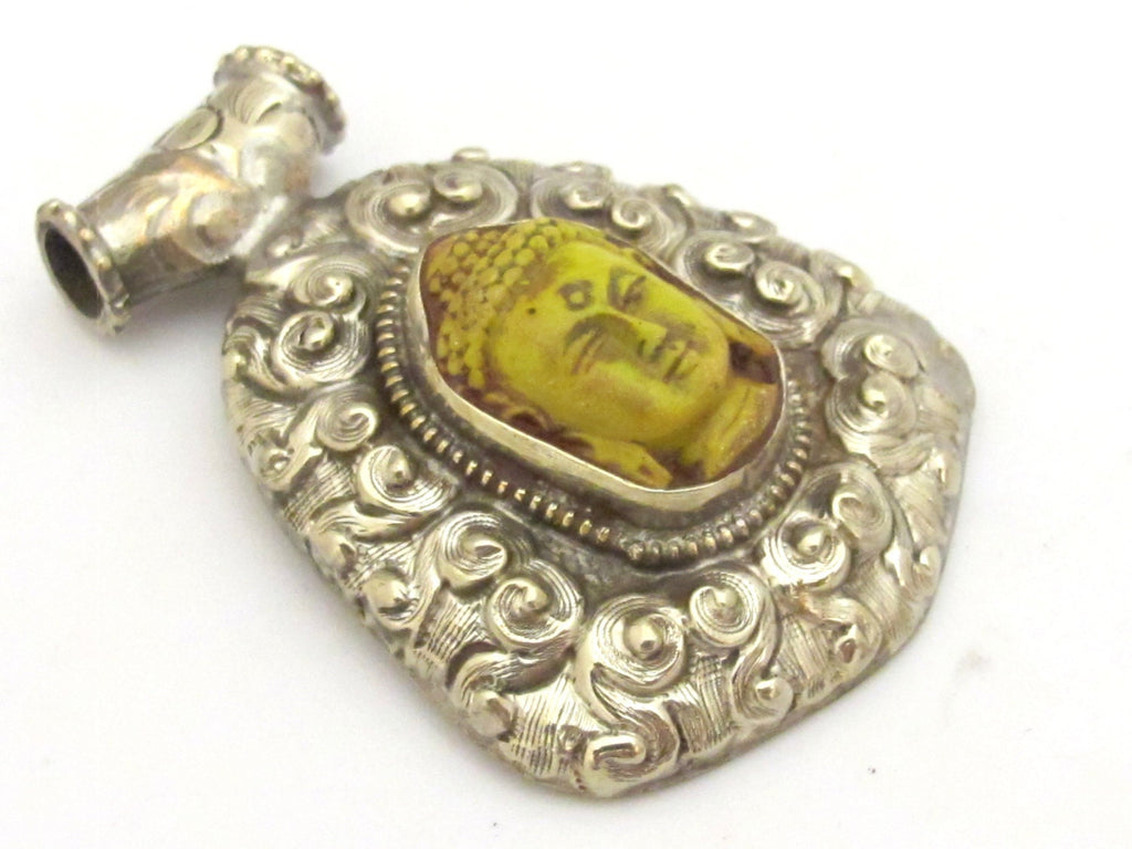 Tibetan silver yellow Buddha pendant with floral repousse details - PM337B