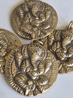 Oval Shape Seated four armed Ganesha brass charm pendant from Nepal - CP054