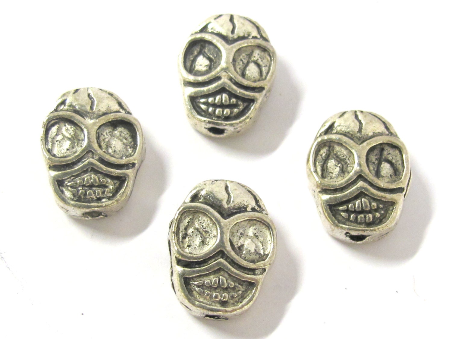 4 Beads - Reversible antiqued silver tone metal skull beads - BD293A
