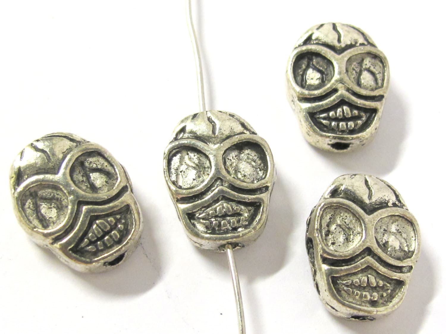 4 Beads - Reversible antiqued silver tone metal skull beads - BD293A