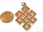 Tibetan endless knot symbol pendant with coral inlay from Nepal - PM416-CBA2