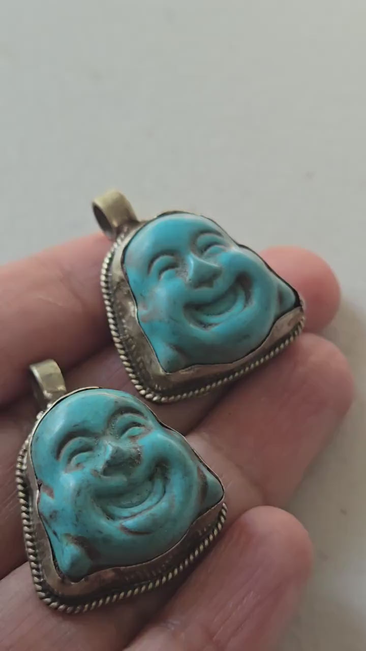 Tibetan antiqued silver color encased turquoise howlite happy Buddha face focal pendant floral carving - PM001A